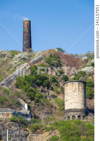 The large chimney of the Hitachi Mine: A historical building representing industrial development. The large chimney of the Hitachi Mine: A historical building representing industrial development. 141137951