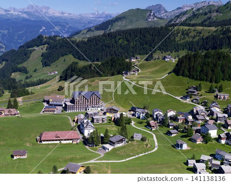 Alpine Panorama Showcasing Stoos Village and the Surrounding Swiss Alps Alpine Panorama Showcasing Stoos Village and the Surrounding Swiss Alps 141138136