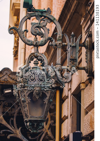 Old vintage metal lanterns or street lamps on building of Opera de Nice, France 141138193