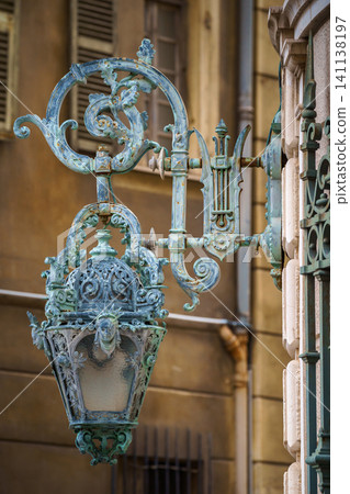 Old vintage metal lanterns or street lamps on building of Opera de Nice, France Old vintage metal lanterns or street lamps on building of Opera de Nice, France 141138197