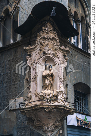 GENOA, ITALY - NOVEMBER 04, 2018 - Madonna shrine on the facade of the old house in Genoa GENOA, ITALY - NOVEMBER 04, 2018 - Madonna shrine on the facade of the old house in Genoa 141138328
