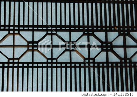 Beautiful kumiko latticework (geometric patterns on shoji screens) in old Japanese houses, showcasing the craftsmanship of Japanese artisans. Beautiful kumiko latticework (geometric patterns on shoji screens) in old Japanese houses, showcasing the craftsmanship of Japanese artisans. 141138515