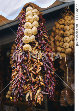 Dried herbs, spices, garlic and pepper hung Dried herbs, spices, garlic and pepper hung 141138556