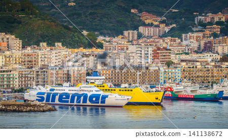 MESSINA, ITALY - NOVEMBER 06, 2018 - Panoramic view of the buildings on the side of the port in Sicily where big ferry ships are docking in Italy MESSINA, ITALY - NOVEMBER 06, 2018 - Panoramic view of the buildings on the side of the port in Sicily where big ferry ships are docking in Italy 141138672