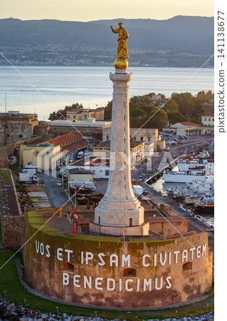 MESSINA, ITALY - NOVEMBER 06, 2018 - Forte del Santissimo Salvatore with statue of Saint Mary or Madonna Della Lettera and the port MESSINA, ITALY - NOVEMBER 06, 2018 - Forte del Santissimo Salvatore with statue of Saint Mary or Madonna Della Lettera and the port 141138677
