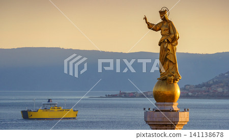 MESSINA, ITALY - NOVEMBER 06, 2018 - Close-up of the statue of Saint Mary or Madonna Della Lettera with the ship and the sea MESSINA, ITALY - NOVEMBER 06, 2018 - Close-up of the statue of Saint Mary or Madonna Della Lettera with the ship and the sea 141138678