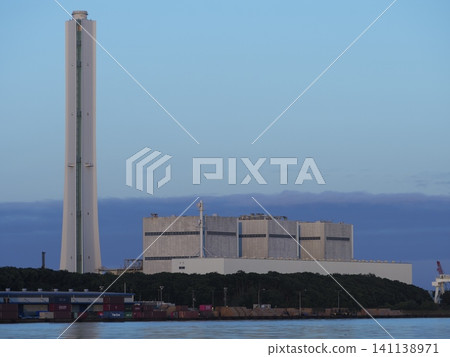 Towering chimneys of a power plant Towering chimneys of a power plant 141138971