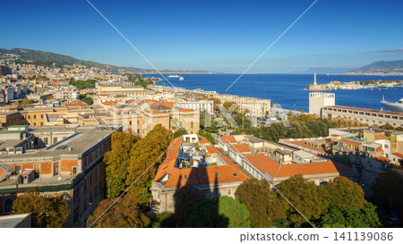 Panoramic top view of the local buildings with the trees, mountains and the sky in the beautiful city of Messina, Sicily, Italy Panoramic top view of the local buildings with the trees, mountains and the sky in the beautiful city of Messina, Sicily, Italy 141139086