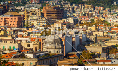 Panoramic top view of the local buildings with the trees, mountains and the sky in the beautiful city of Messina, Sicily, Italy Panoramic top view of the local buildings with the trees, mountains and the sky in the beautiful city of Messina, Sicily, Italy 141139087