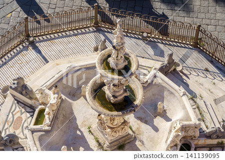 MESSINA, ITALY - NOVEMBER 06, 2018 - Top view on the fountain of Orion on Piazza del Duomo and its details and elements MESSINA, ITALY - NOVEMBER 06, 2018 - Top view on the fountain of Orion on Piazza del Duomo and its details and elements 141139095