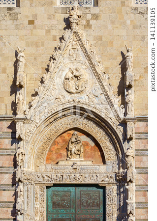 MESSINA, ITALY - NOVEMBER 06, 2018 - Elements of decoration of the doors of the Bell Tower of the Cathedral of Messina, Sicily MESSINA, ITALY - NOVEMBER 06, 2018 - Elements of decoration of the doors of the Bell Tower of the Cathedral of Messina, Sicily 141139105