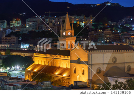 Panoramic top night view of the local buildings with lights, mountains in the beautiful city of Messina, Sicily, Italy Panoramic top night view of the local buildings with lights, mountains in the beautiful city of Messina, Sicily, Italy 141139106
