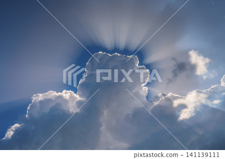 Sun shining through the heavenly beautiful clouds Sun shining through the heavenly beautiful clouds 141139111