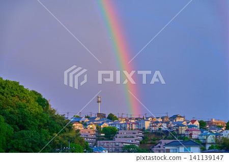 An airplane enters a rainbow that appeared in the city of Kawasaki, Kanagawa Prefecture. 141139147
