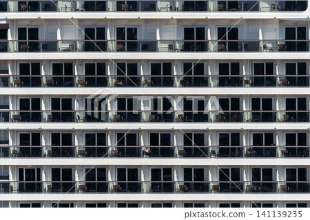 Messina, Italy - Nov 5 2018, panoramic view of the facade of a cruise ship with windows of many cabins, without people, MSC Seaview moored in the port of Messina, Italy Messina, Italy - Nov 5 2018, panoramic view of the facade of a cruise ship with windows of many cabins, without people, MSC Seaview moored in the port of Messina, Italy 141139235