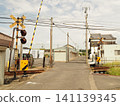 A train passing through a railroad crossing 141139345
