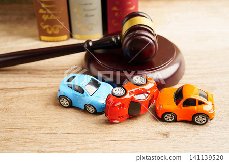 Bangkok, Thailand March 15, 2023 Car accident lawsuit and insurance, Judge hammer with car model. Bangkok, Thailand March 15, 2023 Car accident lawsuit and insurance, Judge hammer with car model. 141139520