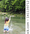 Girls playing on the river 141139712