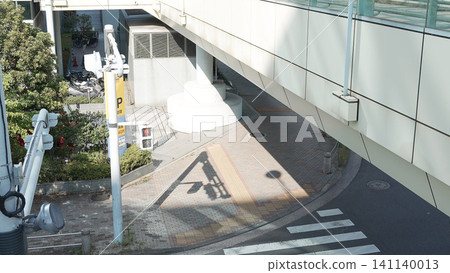 Parking signs and shadows cast over a city pedestrian underpass Parking signs and shadows cast over a city pedestrian underpass 141140013