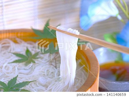 The moment I picked up the somen noodles served in the bucket with my chopsticks The moment I picked up the somen noodles served in the bucket with my chopsticks 141140659