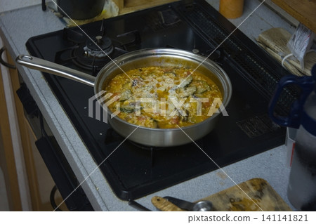 Risotto in the kitchen Risotto in the kitchen 141141821