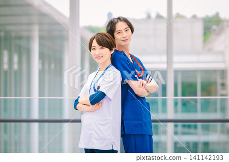Young doctors and nurses working in a medical facility Young doctors and nurses working in a medical facility 141142193