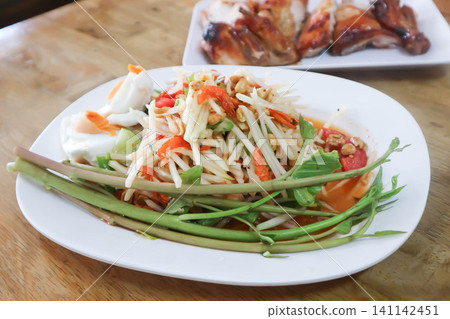 spicy salad, som tam or Thai spicy salad or papaya salad or vegetable salad spicy salad, som tam or Thai spicy salad or papaya salad or vegetable salad 141142451
