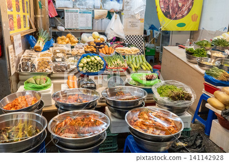 Homemade kimchi and authentic fresh vegetables and ingredients lined up in traditional Korean markets. Homemade kimchi and authentic fresh vegetables and ingredients lined up in traditional Korean markets. 141142928