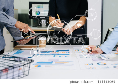Team business meeting presentation. Hand businessman working project in modern office.Laptop computer and tablet and smart phone on white desk Team business meeting presentation. Hand businessman working project in modern office.Laptop computer and tablet and smart phone on white desk 141143065