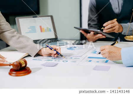business people and lawyers discussing contract papers sitting at the table. Concepts of law, advice, legal services.in office business people and lawyers discussing contract papers sitting at the table. Concepts of law, advice, legal services.in office 141143146