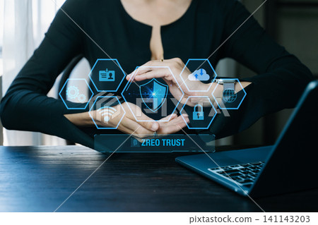 Zero trust security concept Person using computer and tablet with zero trust icon on virtual screen of Data businesses.in office Zero trust security concept Person using computer and tablet with zero trust icon on virtual screen of Data businesses.in office 141143203