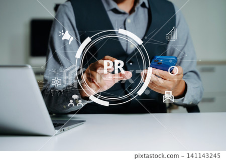 PR, Public relations concept. hands using laptop and tablet with public relations icon for communication advertising marketing strategy. with Ads and sales PR, Public relations concept. hands using laptop and tablet with public relations icon for communication advertising marketing strategy. with Ads and sales 141143245