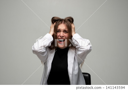 Woman experiencing extreme stress and burnout, screaming in agony, pulling hair due to overwhelming anxiety and frustration Woman experiencing extreme stress and burnout, screaming in agony, pulling hair due to overwhelming anxiety and frustration 141143594