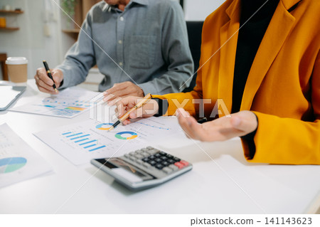 Businessman and team analyzing financial statement Finance task. with smart phone and laptop and tablet. Businessman and team analyzing financial statement Finance task. with smart phone and laptop and tablet. 141143623