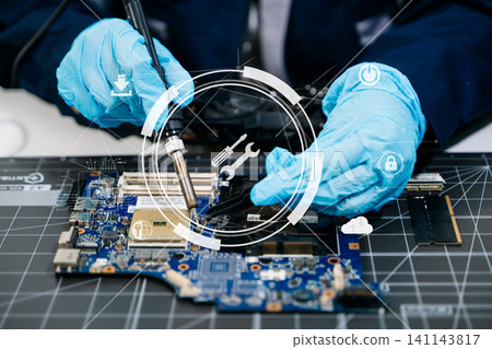 technician soldering microchip on circuit board, highlighting precision electronics repair, hardware maintenance, and advanced technology work. 141143817