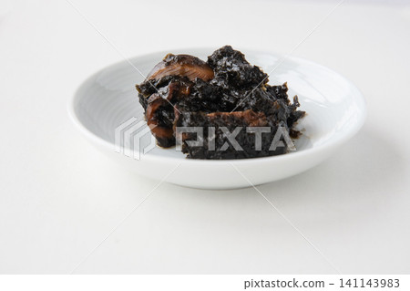 A small plate of freshly made seaweed tsukudani (simmered seaweed). A small plate of freshly made seaweed tsukudani (simmered seaweed). 141143983