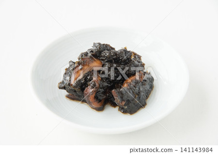 A small plate of freshly made seaweed tsukudani (simmered seaweed). A small plate of freshly made seaweed tsukudani (simmered seaweed). 141143984
