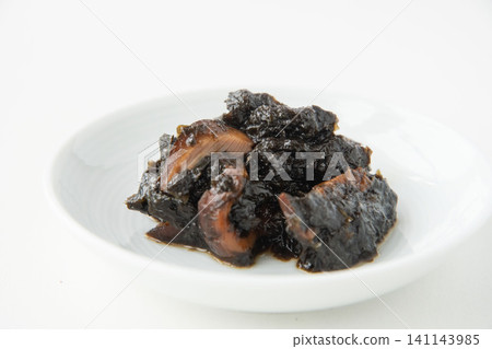 A small plate of freshly made seaweed tsukudani (simmered seaweed). A small plate of freshly made seaweed tsukudani (simmered seaweed). 141143985