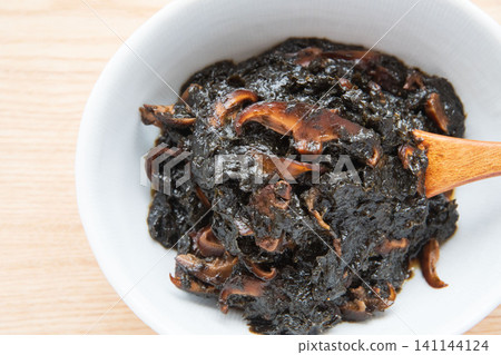 Freshly made seaweed tsukudani served in a bowl. Freshly made seaweed tsukudani served in a bowl. 141144124