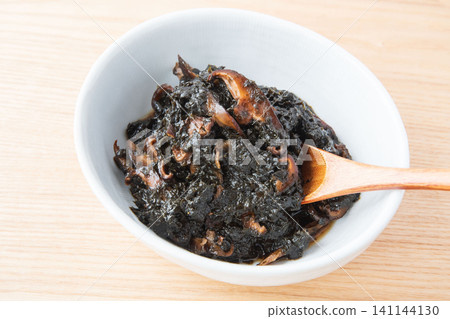 Freshly made seaweed tsukudani served in a bowl. Freshly made seaweed tsukudani served in a bowl. 141144130