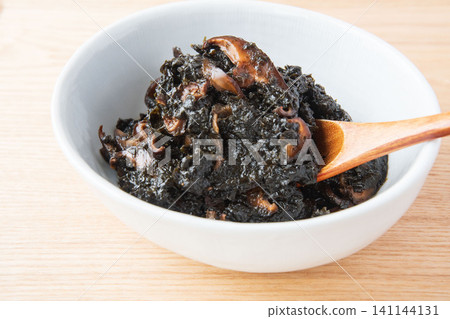 Freshly made seaweed tsukudani served in a bowl. Freshly made seaweed tsukudani served in a bowl. 141144131