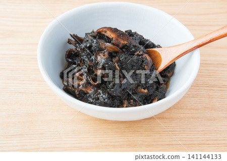 Freshly made seaweed tsukudani served in a bowl. Freshly made seaweed tsukudani served in a bowl. 141144133