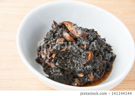 Freshly made seaweed tsukudani served in a bowl. Freshly made seaweed tsukudani served in a bowl. 141144144