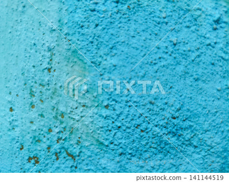 Abstract background of a weathered and distressed wall with peeling paint and plaster in faded light blue and beige tones, showcasing aged texture and grunge details. Abstract background of a weathered and distressed wall with peeling paint and plaster in faded light blue and beige tones, showcasing aged texture and grunge details. 141144519