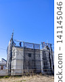A panoramic view of the ongoing roof construction on a house after exterior wall renovation. A panoramic view of the ongoing roof construction on a house after exterior wall renovation. 141145046