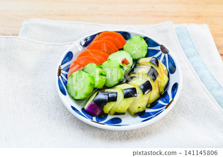 Lightly pickled summer vegetables served on a plate Lightly pickled summer vegetables served on a plate 141145806