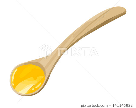 A wooden spoon scooped with pumpkin soup. 141145922