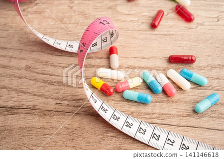 Measuring tape and tablet drug medical for diet. Measuring tape and tablet drug medical for diet. 141146618