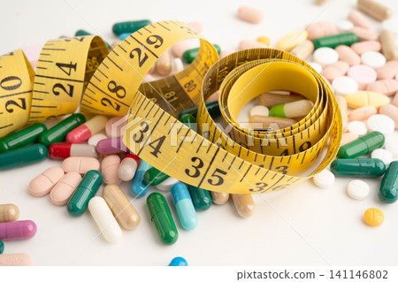 Measuring tape and tablet drug medical for diet. 141146802