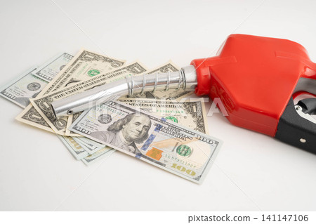 Gas pump, Fuel Nozzle with dollar money for cost energy. Gas pump, Fuel Nozzle with dollar money for cost energy. 141147106